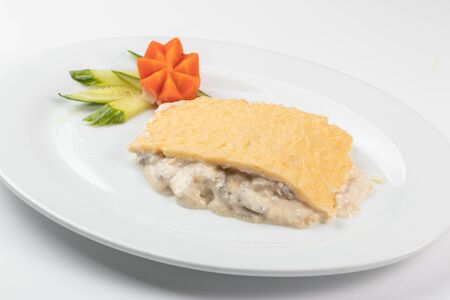 Mushroom julienne on a white dishの写真素材