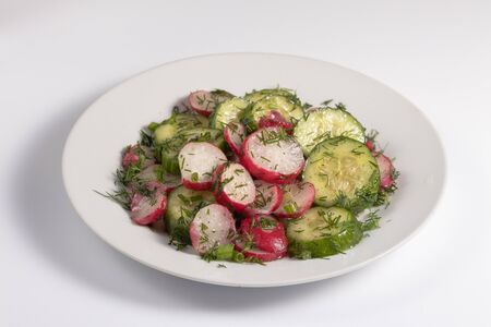 Salad with green cucumber, radish, dill and olive oil