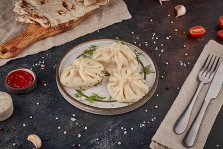 Dumplings with meat, georgian cuisine, textured dark backgroundの写真素材