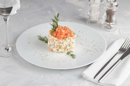 Traditional salad Russian cuisine Olivier. Light background.の写真素材
