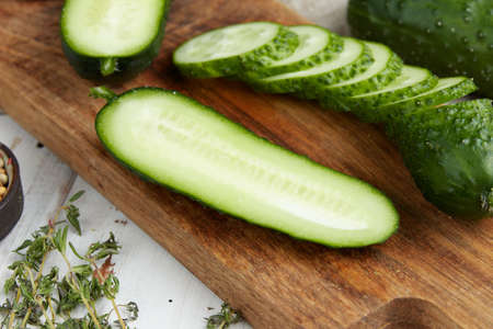 Fresh cucumber on white wood tableの写真素材