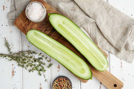 Fresh cucumber on white wood tableの写真素材