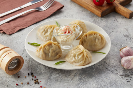 gyoza dumplings with and without red sauceの写真素材