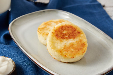 Cottage cheese pancakes with sour cream, closeupの写真素材