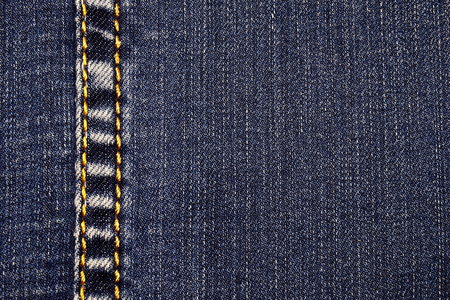  Fashion clothing from denim. Color blue with white. Stitched with a yellow thread with a large...