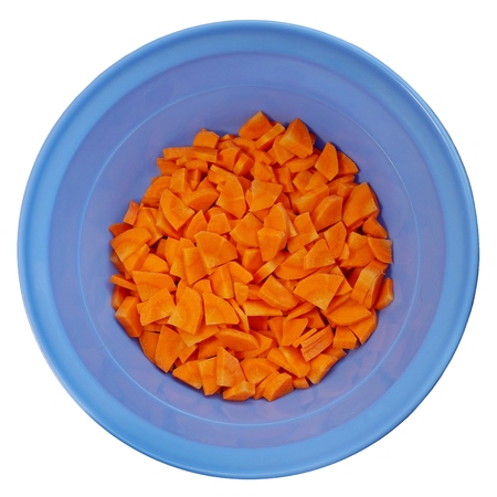 Sliced carrots in a round blue cup. Isolateの写真素材