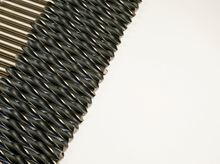 Tool. Drills in a row. White isolated background