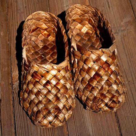 Vintage. Lapti. Ancient homemade shoes of Russian peasants. Sign of poverty.の写真素材