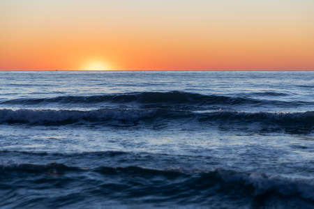 Viareggio winter sea at sunset, with waves, Tuscany, Italy