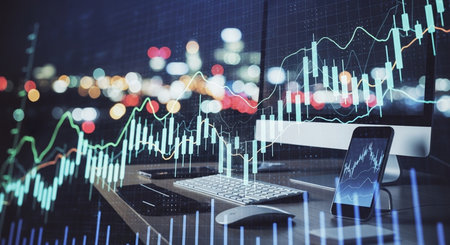 Forex graph hologram on table with computer background. Double exposure. Concept of financial markets.の素材