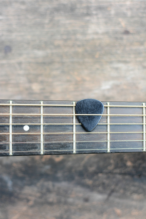 Guitar pick on finger board.の写真素材
