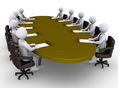 Businessmen sitting around an oval table as a conferenceの写真素材