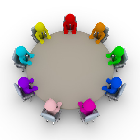 Different colored businessmen are sitting around a tableの写真素材