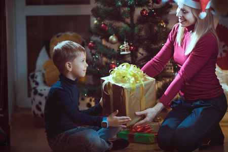 Mother and son exchanging Christmas giftsの写真素材
