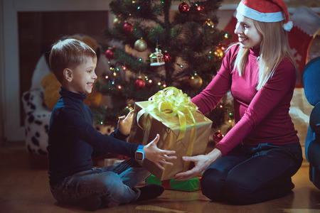Mother and son exchanging Christmas giftsの写真素材