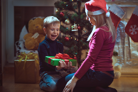 Mother and son exchanging Christmas giftsの写真素材