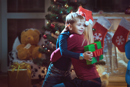 Mother and son exchanging Christmas giftsの写真素材