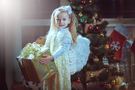 Christmas, Angel - lovely little girl celebrating Christmasの写真素材