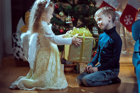 Christmas, Angel - lovely little girl celebrating Christmasの写真素材