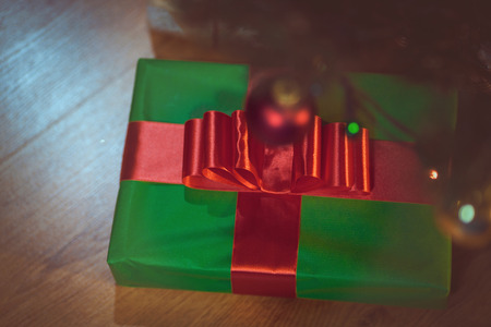 Christmas presents under a Christmas tree with defocused lightsの写真素材