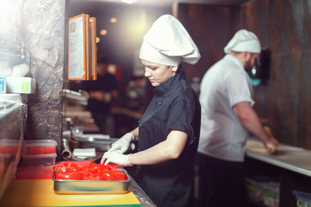 Chef prepares the ingredients for pizzaの写真素材