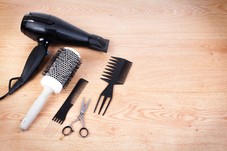 Hairdresser set with various accessories on backgroundの写真素材