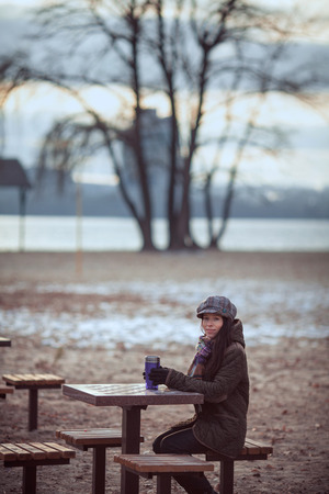 Beautiful woman relaxing on bench, parkの写真素材