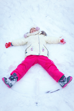 Little girl having fun on winter dayの写真素材