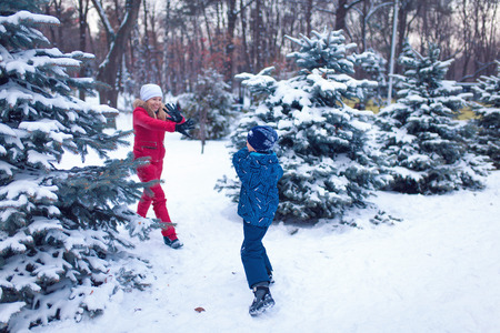 happy young family spending time outdoor in winterの写真素材