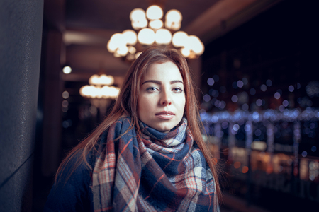 gorgeous brunette girl, portrait in night city lightsの写真素材