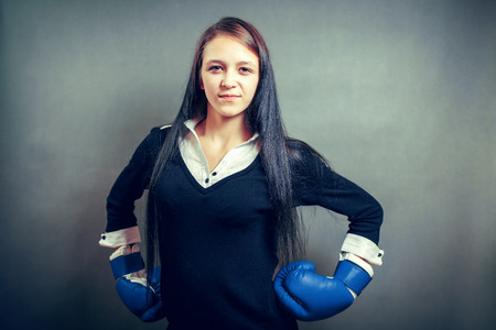 Boxing gloves business woman angry - business concept