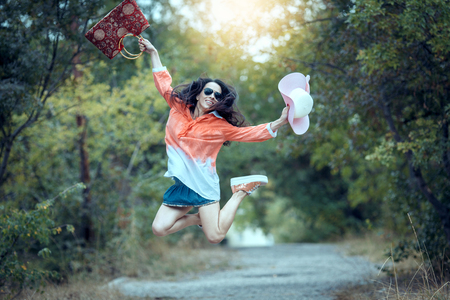 happy young girl with vintage camera walking outdoors in the park, copy spaceの写真素材