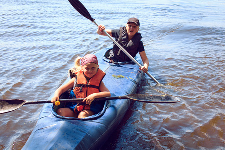 man paddling in kayak is on a river, kayakingの写真素材