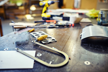 A working table with a set of tools in the workshop.