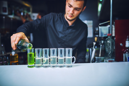 Barman at work, preparing cocktails.  concept about service and beverages.の写真素材