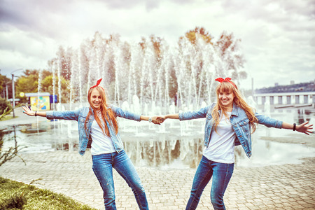 Happy young girl walking in the parkの写真素材