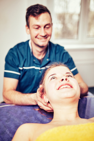  A young professional male masseur makes Thai massage.の写真素材