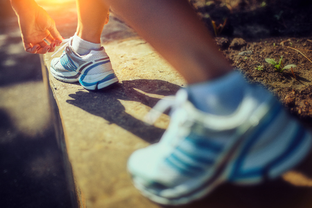 Runner woman doing a morning run in the park
