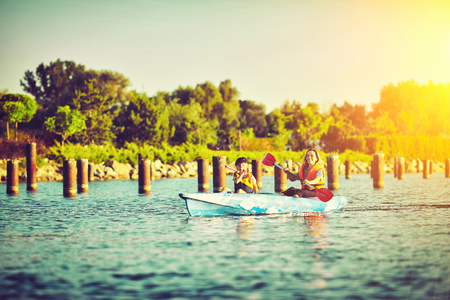 Kayaking and canoeing with family. Children on canoe. Family on kayak ride.の写真素材