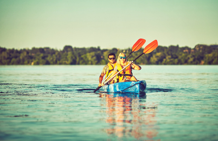 Kayaking and canoeing with family. Children on canoe. Family on kayak ride.の写真素材