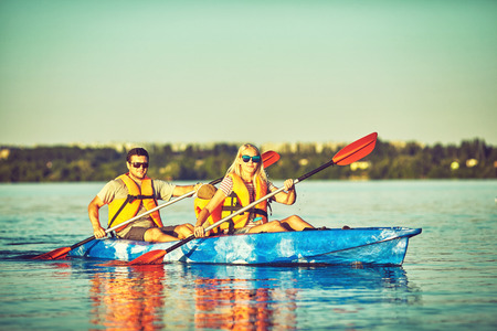 Kayaking and canoeing with family. Children on canoe. Family on kayak ride.の写真素材