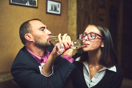 Cold chilled champagne in ice bucket with glassesの写真素材
