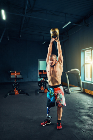 Disabled young man training in the gymの写真素材