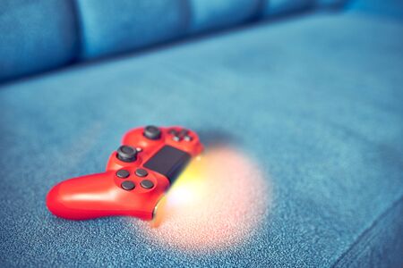 Gamepad for playing video games on the backgroundの写真素材