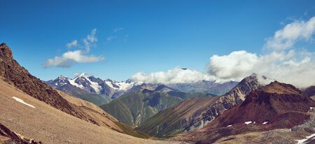 Panorama with valley,  distant mountains. Sunny summer day in the mountains.の写真素材
