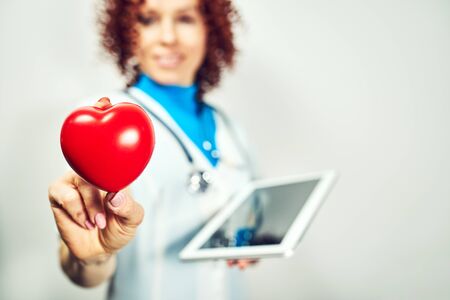 Woman doctor using tablet computer in hospital