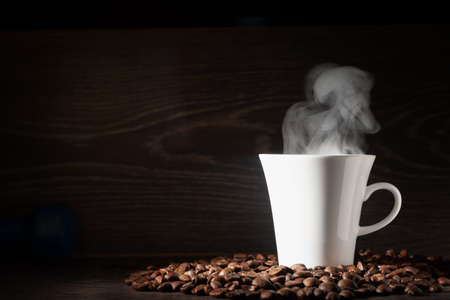 Latte coffee or coffe on wood table at cafe in the morningの写真素材