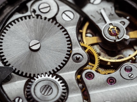 Ancient tiny metal clockwork close up background