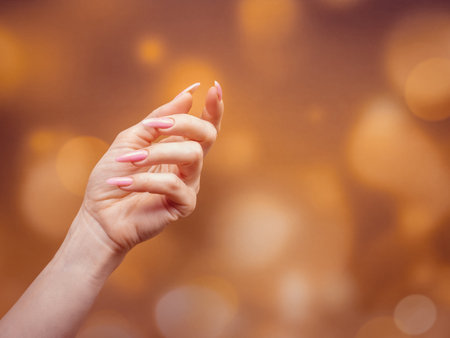 Beautiful Woman Hands. Spa and Manicure concept. Female hands with pink manicure.の写真素材