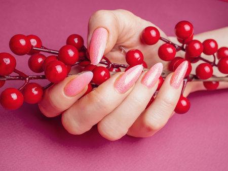Beautiful Woman Hands. Spa and Manicure concept. Female hands with pink manicure.の写真素材